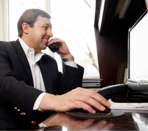 Tyler on the phone with a client.